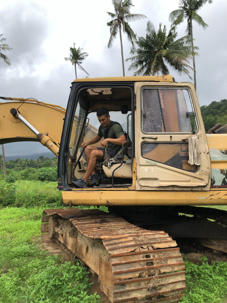 Abandoned excavator on a jungle path inside Grand Lagoona Resort, Koh Chang