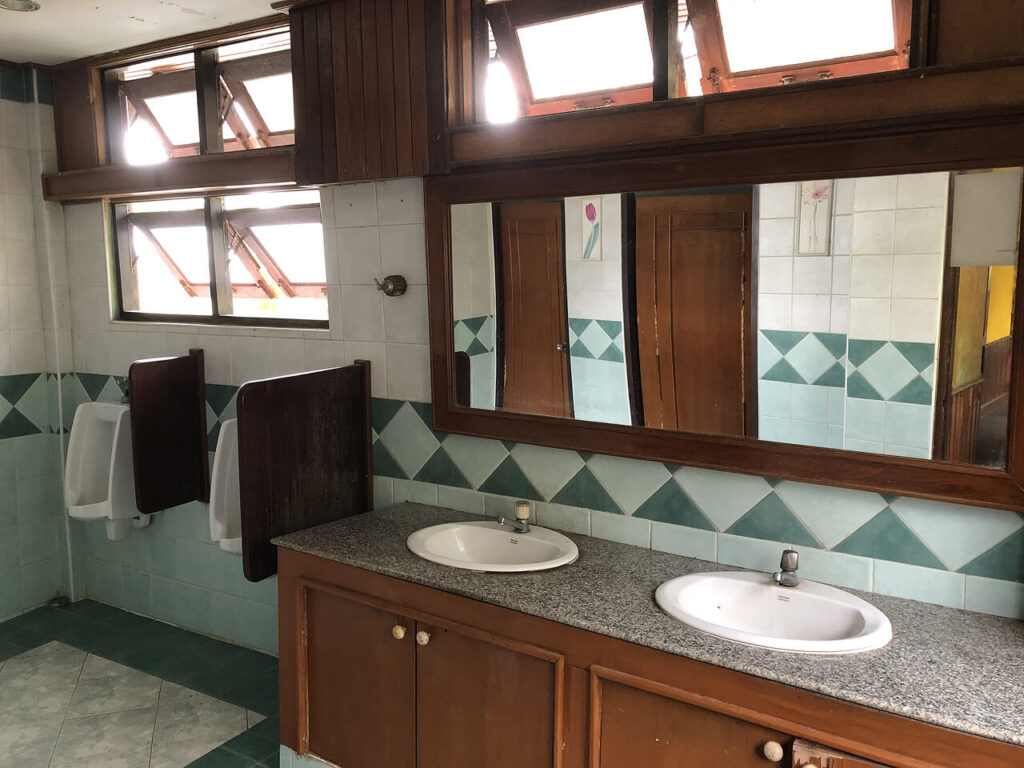 Still-functioning bathroom inside an abandoned ship-themed cottage at Grand Lagoona Resort, Koh Chang