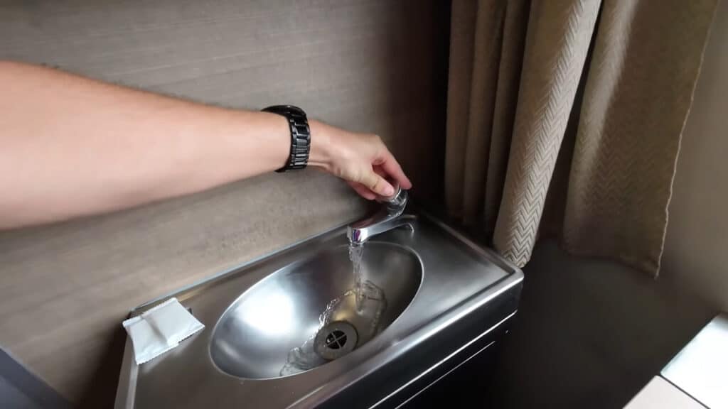 Private sink inside first class sleeper cabin on Special Express CNR train