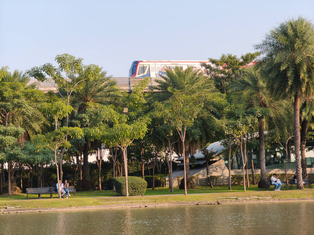 People resting near the water at Chatuchak Park