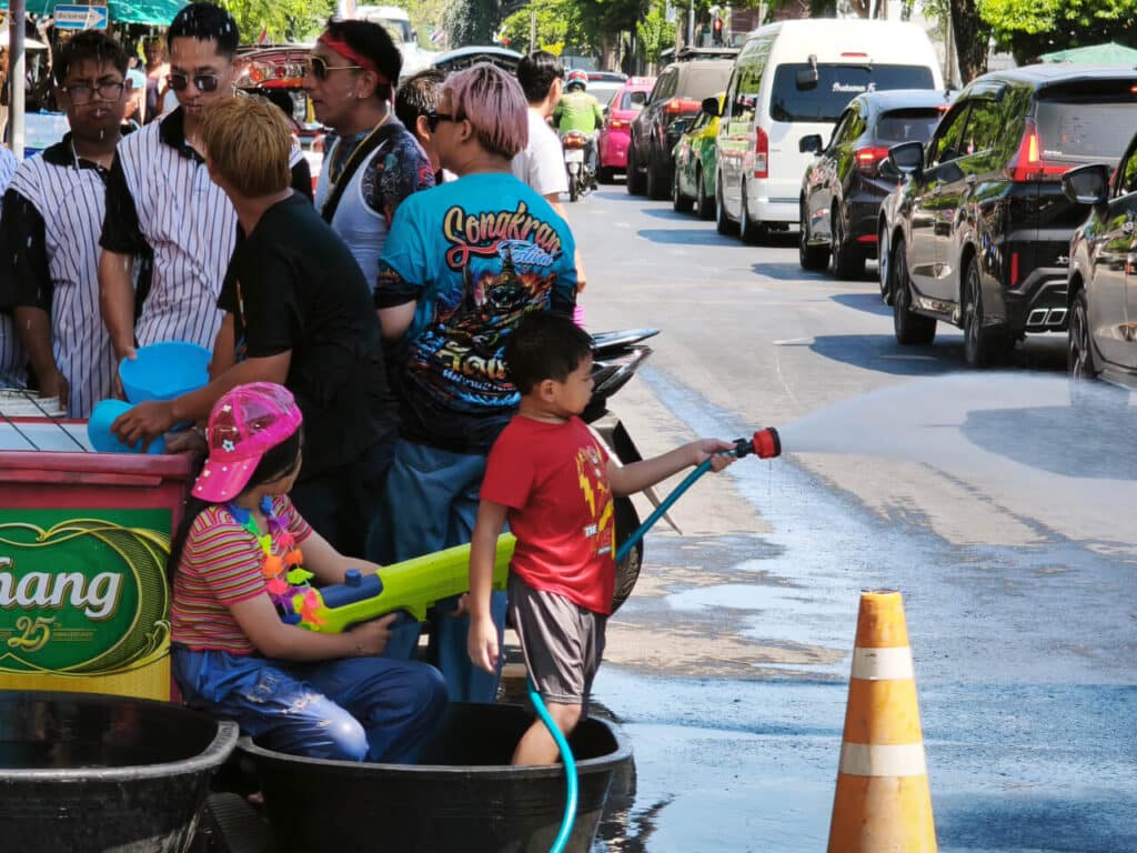 People throw water at passersby during Songkran