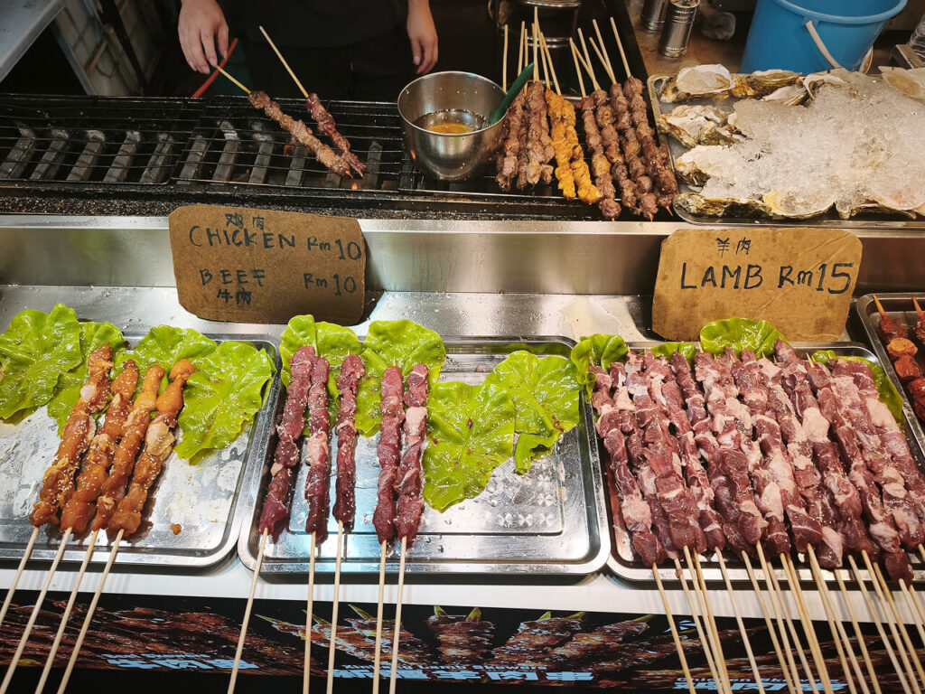 Grilled chicken and lamb skewers at Jalan Alor night market, Kuala Lumpur