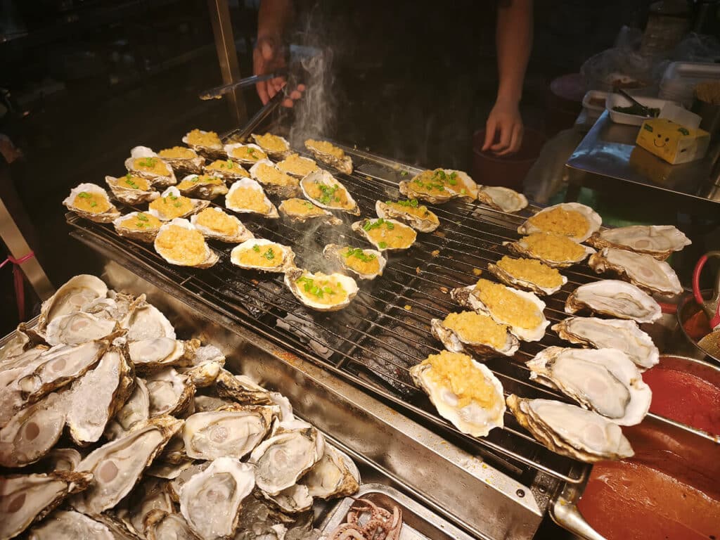Freshly grilled oysters at Jalan Alor Food Street in Kuala Lumpur