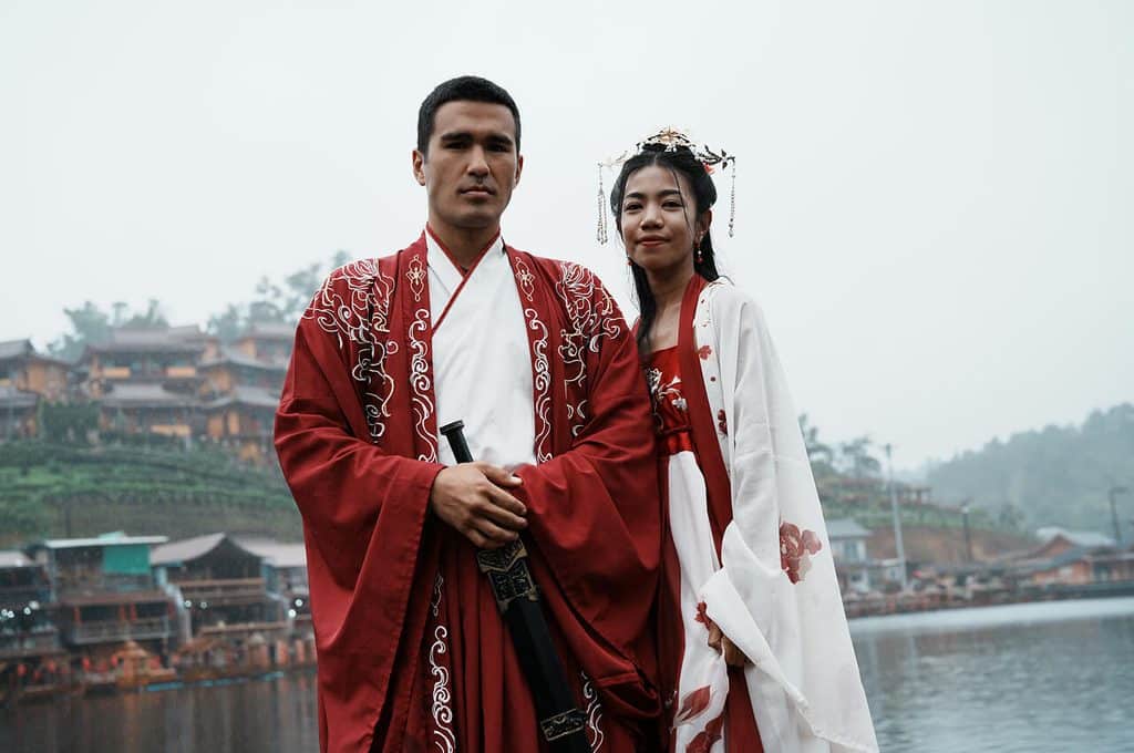 Photo shoot in traditional Chinese costumes on a boat in Ban Rak Thai