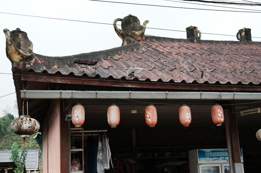Teapots decorating a rooftop in Ban Rak Thai